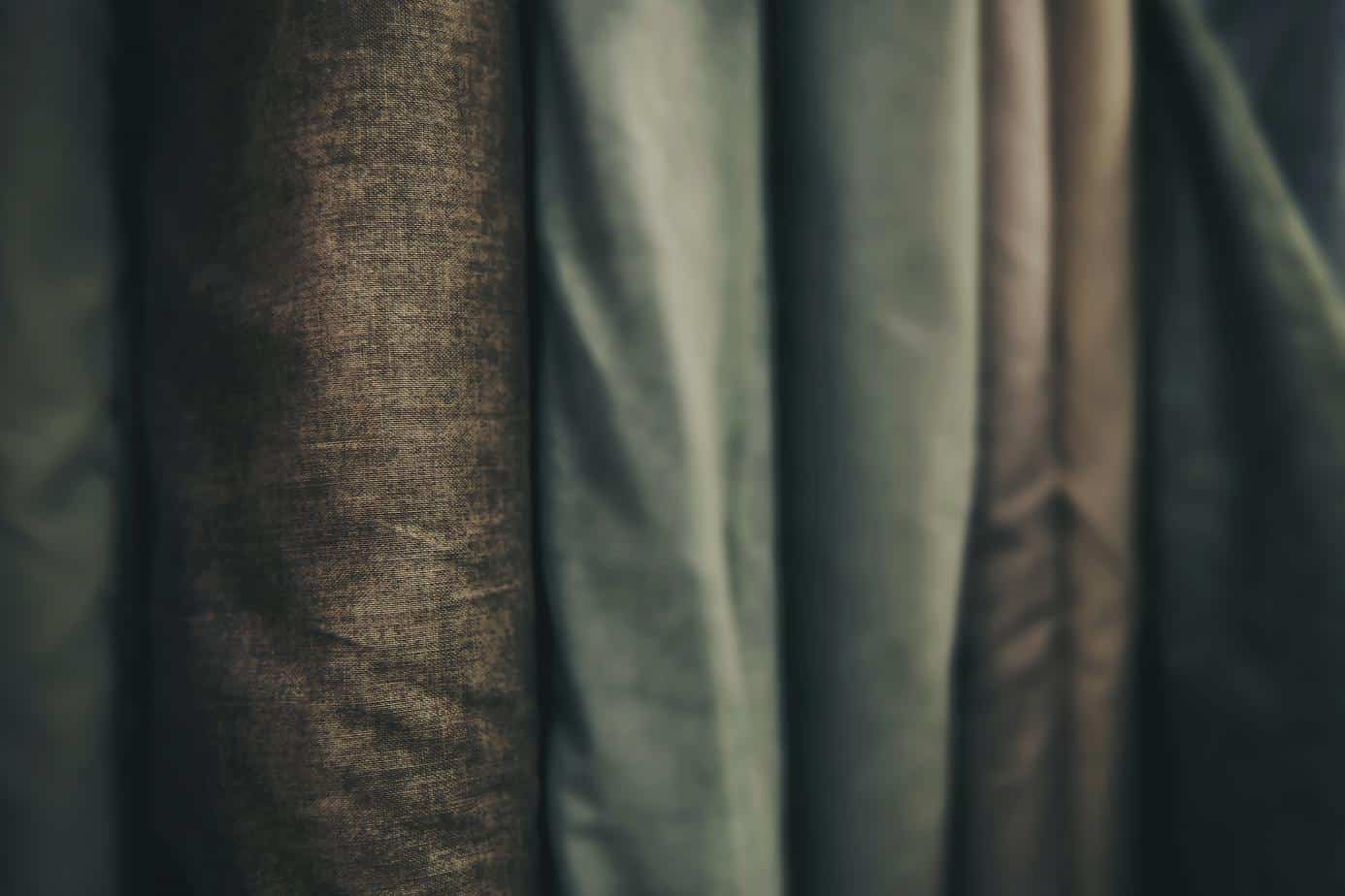 Dark toned fabrics lined up on bolts - home shows on tv